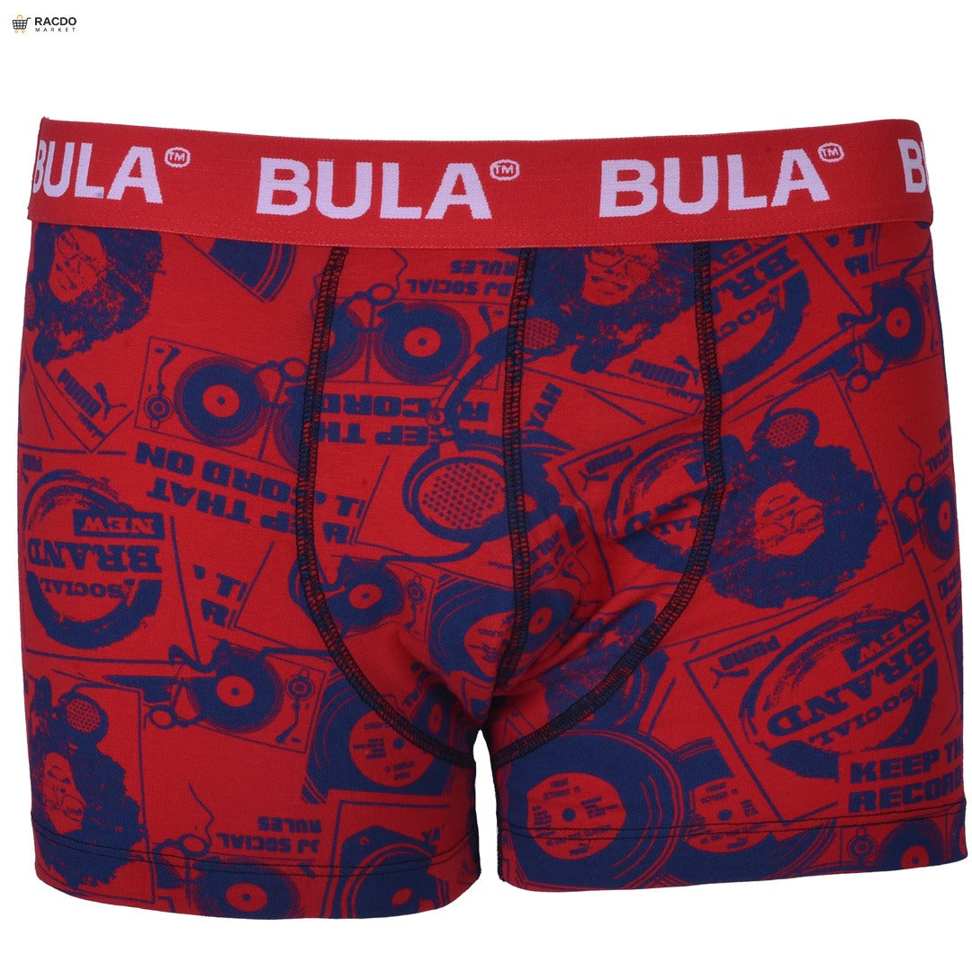 Red boxer briefs with blue graphic design and red waistband featuring 'Bula' branding on a white background.