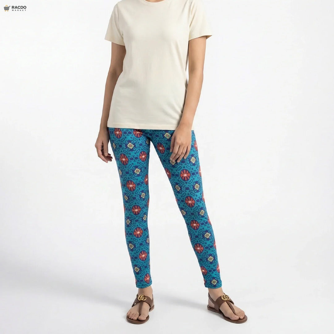 Person wearing blue patterned leggings and a white shirt on a white background