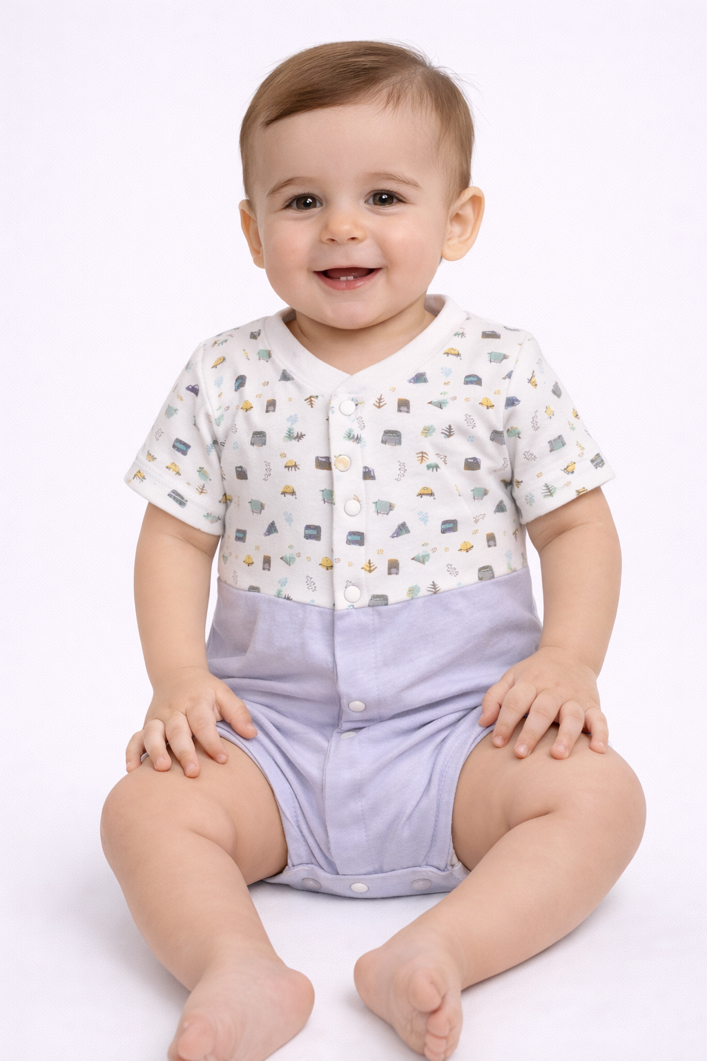 Baby wearing a white shirt with car pattern and purple shorts on a white background