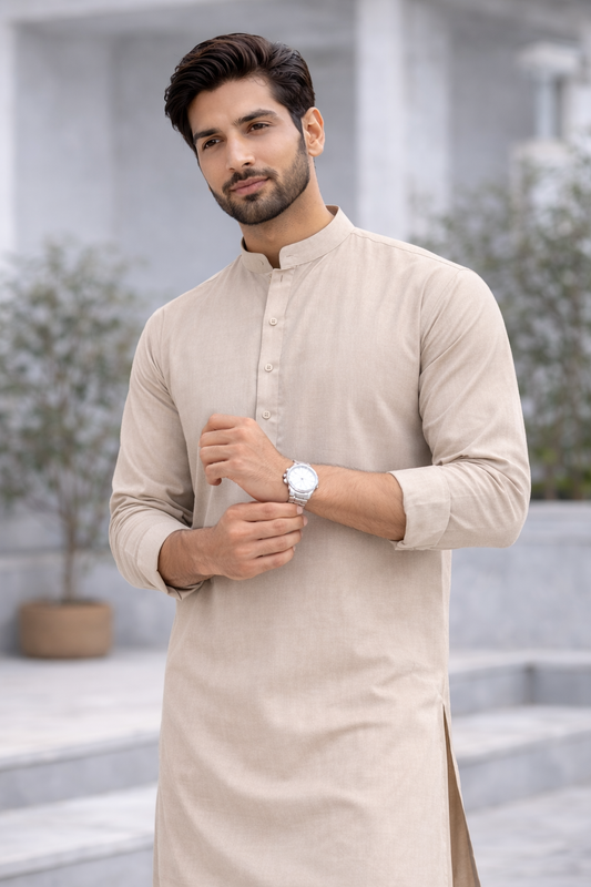 Man wearing a beige kurta with a neutral background

