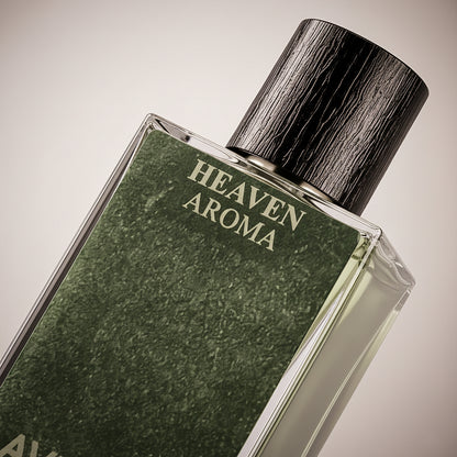 Perfume bottle labeled 'Heaven Aroma' with a textured green label and wooden cap.

