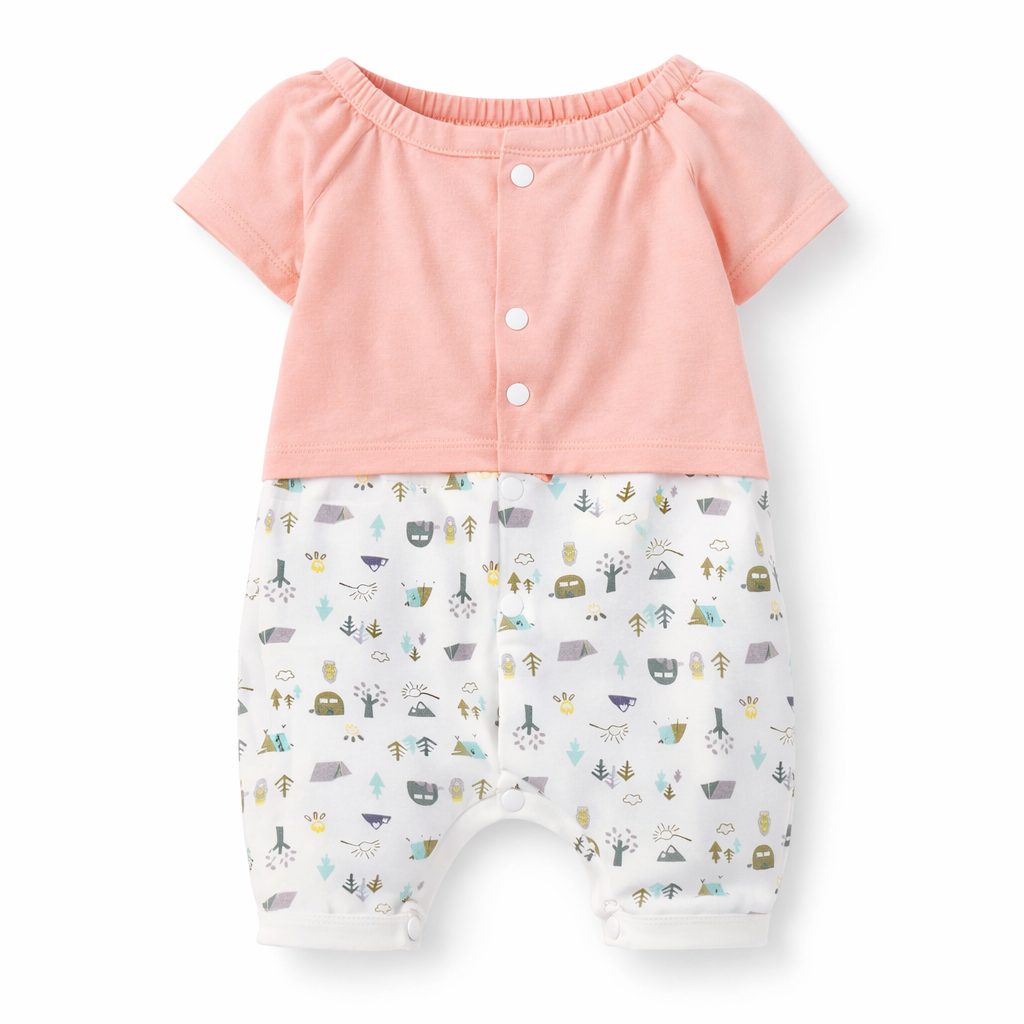 Baby outfit with pink top and patterned shorts on a white background

