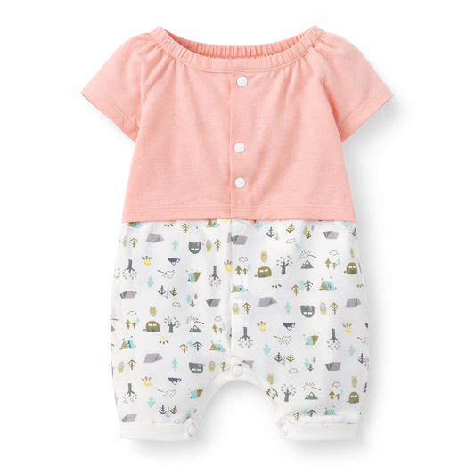 Baby outfit with pink top and patterned shorts on a white background

