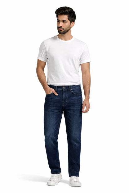 Man wearing a white t-shirt and blue jeans on a white background

