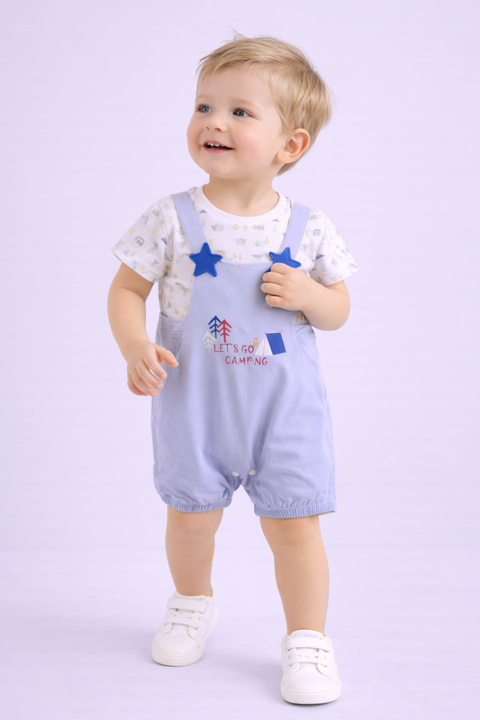 Child wearing a light blue 'Let's Go Camping' outfit with stars on a white background


