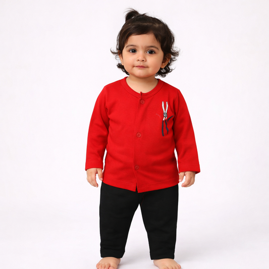 Child wearing a red shirt with a design on a white background

