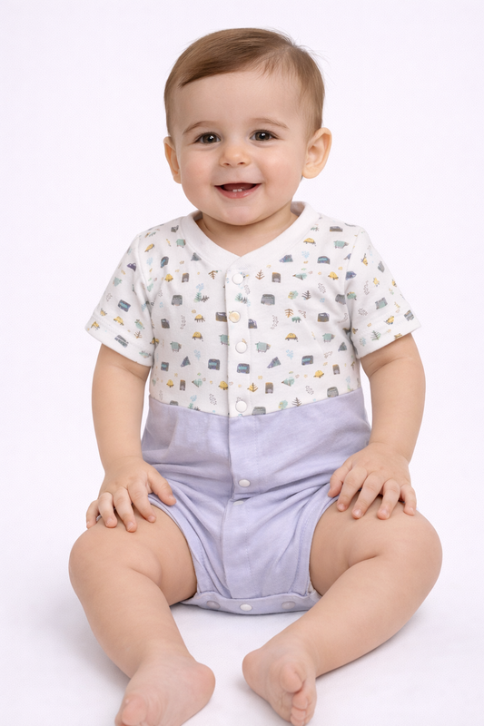 Baby wearing a white shirt with car pattern and purple shorts on a white background

