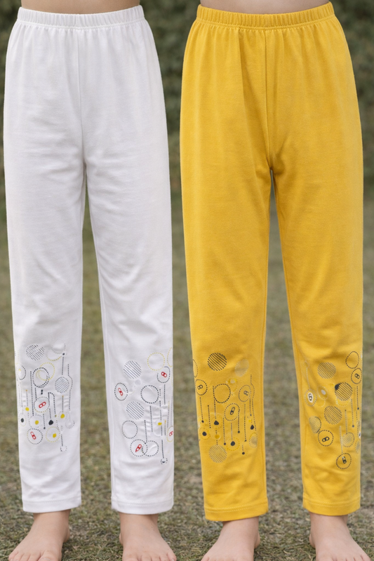 White and yellow pants with cartoon designs on a natural background

