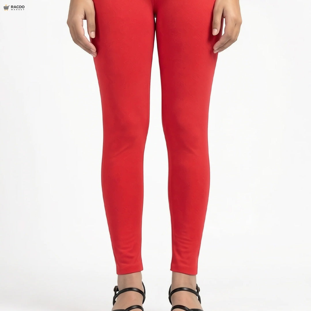 Red leggings worn by a person on a white background

