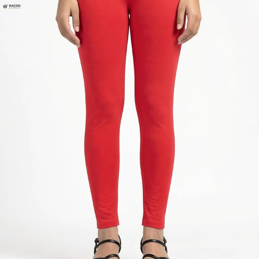 Red leggings worn by a person on a white background

