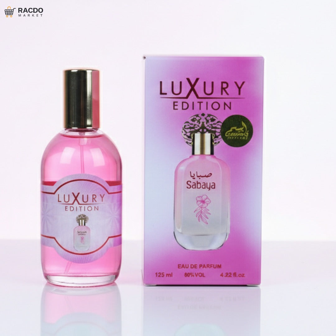 Pink perfume bottle and packaging with 'Luxury Edition' branding on a white background.