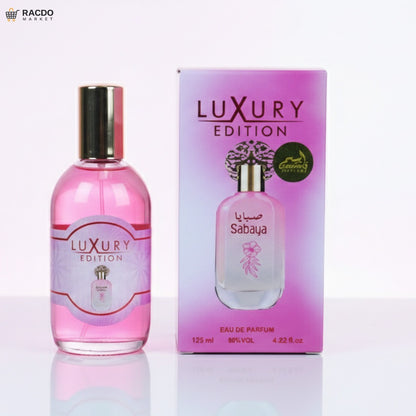 Pink perfume bottle and packaging with 'Luxury Edition' branding on a white background.