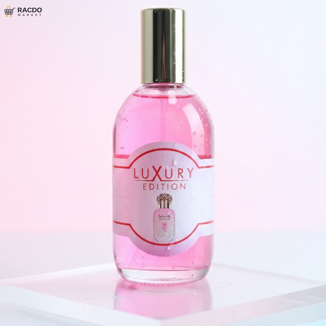 Pink bottle of 'Luxury Edition' on a white background