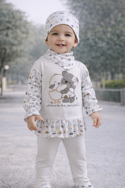 Child wearing a white outfit with a cartoon design outdoors

