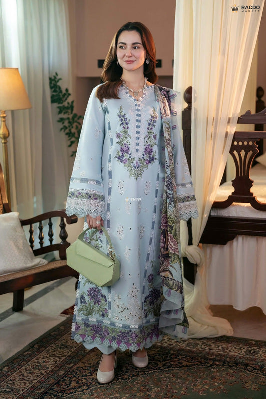 Woman in a floral dress holding a green bag in an indoor setting

